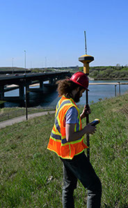 GPS Surveying using TopCon Base Sation and Rover along the South Saskatchewan River in Saskatoon near the South Circle Drive Gordie Howe Bridge 
